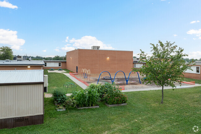 Becky David Elementary School has an outdoor garden behind the main building.