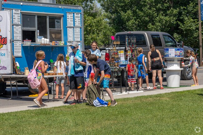 Residents of East Helena Valley head to Main Street Park on a summer day.