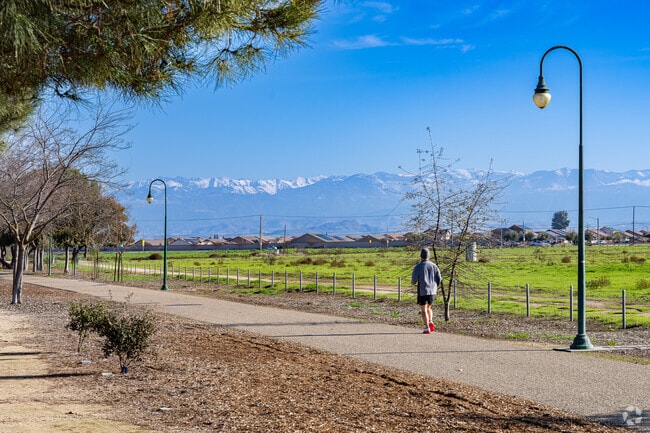 A Tulare Southeast jogger enjoys the view of the Sierra Nevada mountains.