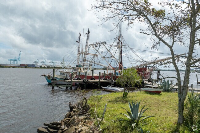 These old boats sit across from Blount Island , and other leg of the Jacksonville port.