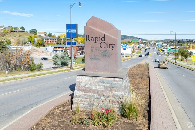 A city gateway sign welcomes drivers to Southeast Rapid City, SD.