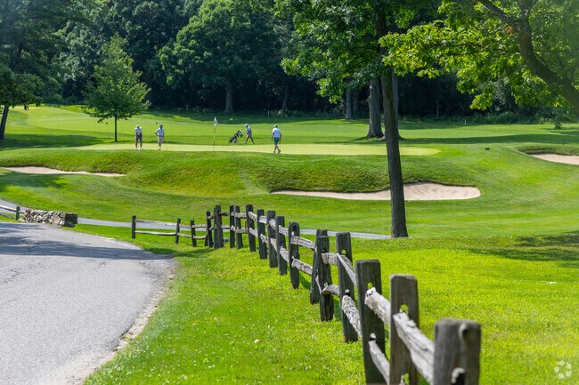 Golfers can play a round of 18 holes at the Burlington Country Club near Five Avenues.