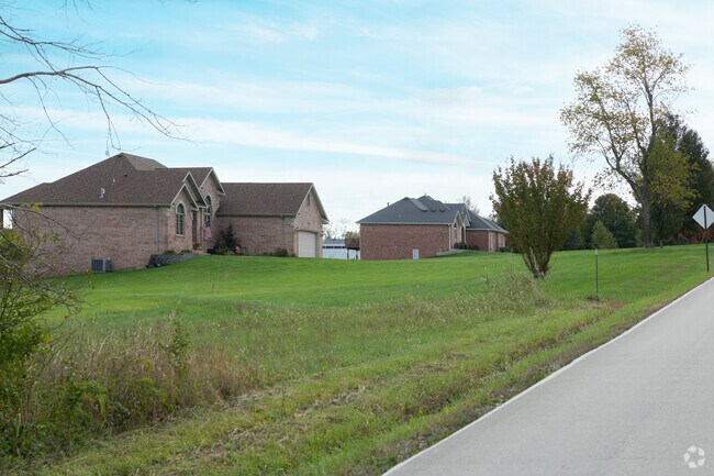 Brick homes line a quiet country road in the spacious West Springfield area.