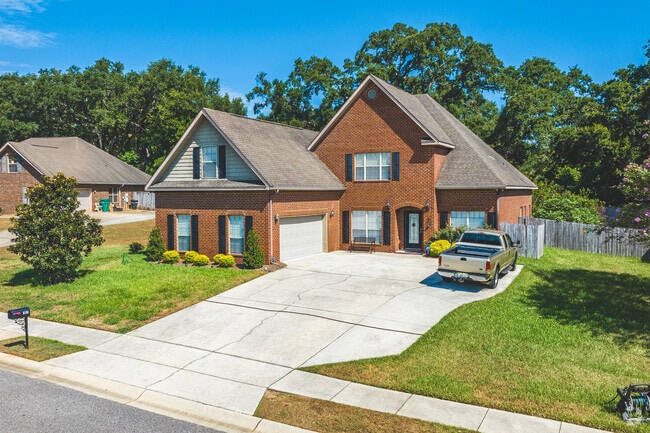 A handful of two-story brick buildings stand in Westmont, Mobile.