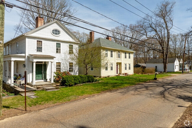 A row of homes in Chaplin's historic district are closer together with rural backyards.