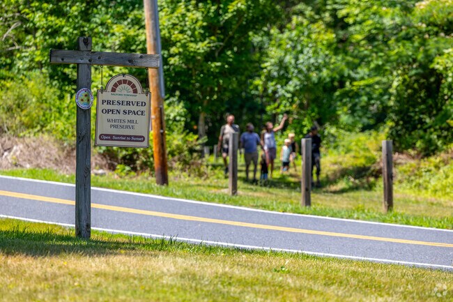 Families gather on preserved open space at Whites Mill Preserve in Salford Township.