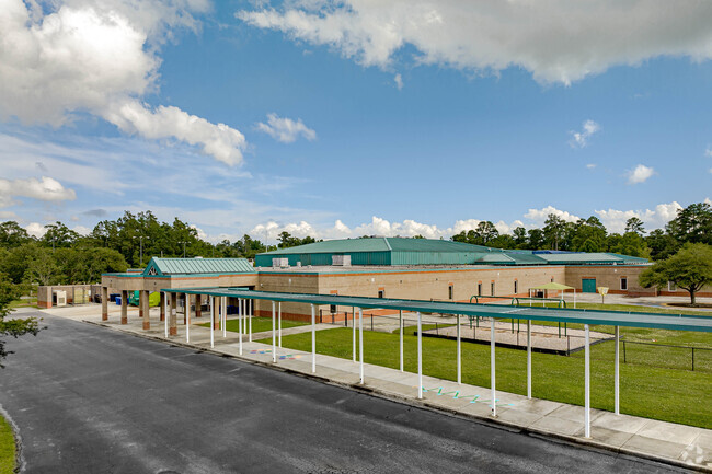 Covered walkways shelter children from rainy weather at Conway Elementary School in Conway.