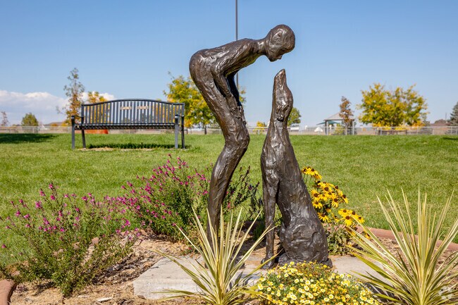 This sculpture at Broomfield Commons Park depicts the love between dogs and dog owners.