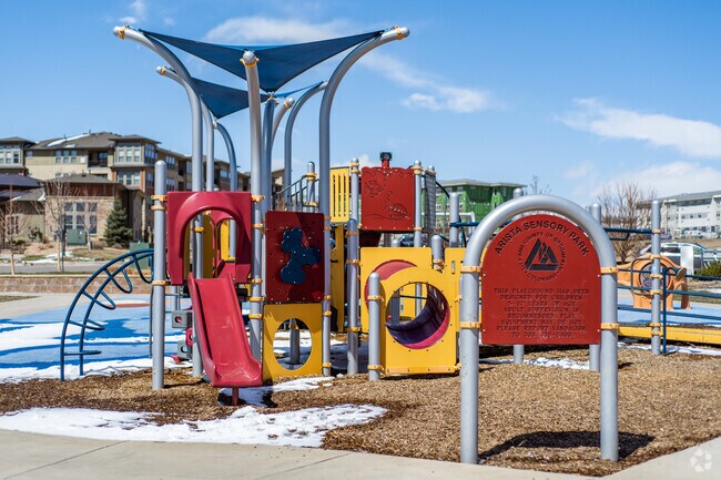 Arista Sensory Park Playground and Sign.