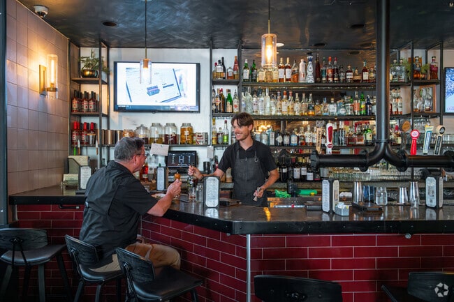 District Kitchen + Cocktails draws a lively happy hour near Sendera.