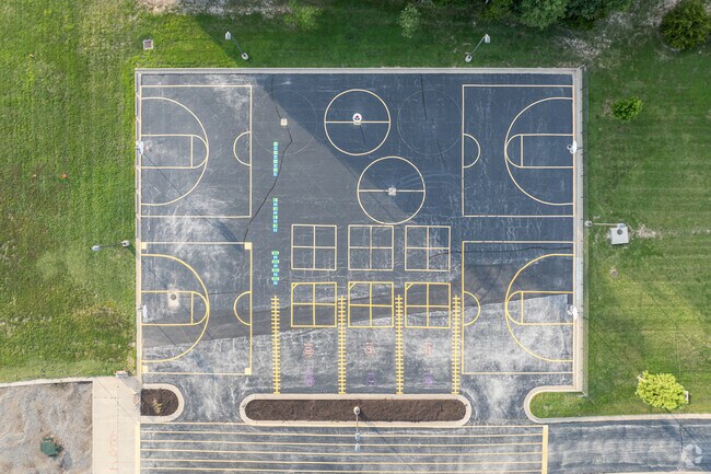 Alpha Hart Lewis Elementary School has a large blacktop play area for their students.