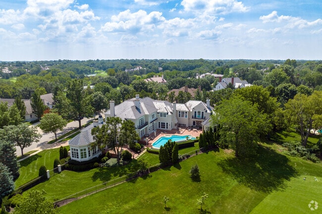 Luxury homes in Leawood are scattered along hillsides, with parks and country clubs weaving through the neighborhoods.