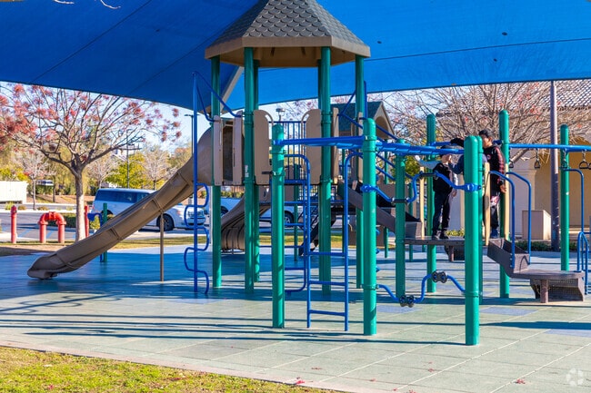 Kids flock to the playground at Rosetta Canyon Park after school.