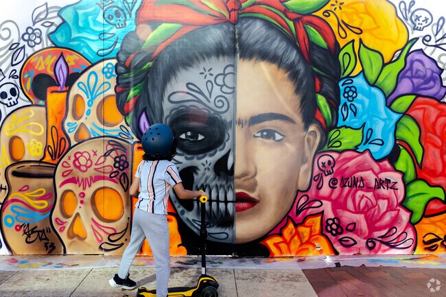 During Halloween, Elgin downtown shows large murals near the river walk.