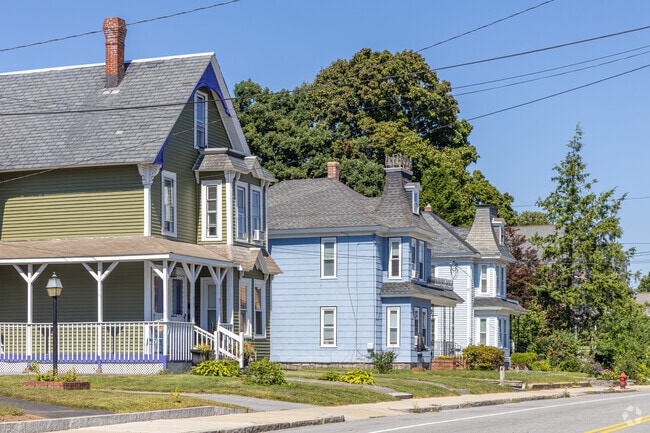 A row of Victorian and New England styled homes in The Highlands neighborhood of Lowell, MA.