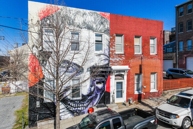 Check out Jeremy Raymer's mural on a rowhouse in Lower Lawrenceville.