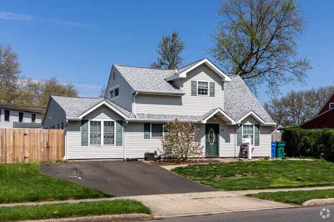 Homes in Levittown have driveways for the residents to park.