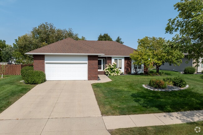 A rambler style home with a neat front garden in Stonebridge.