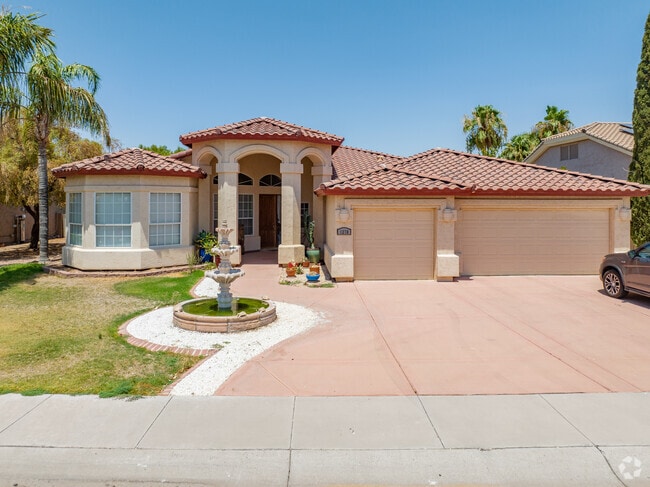This spacious home has a nice water fountain that leads into its grand entrance in Casa Grande.