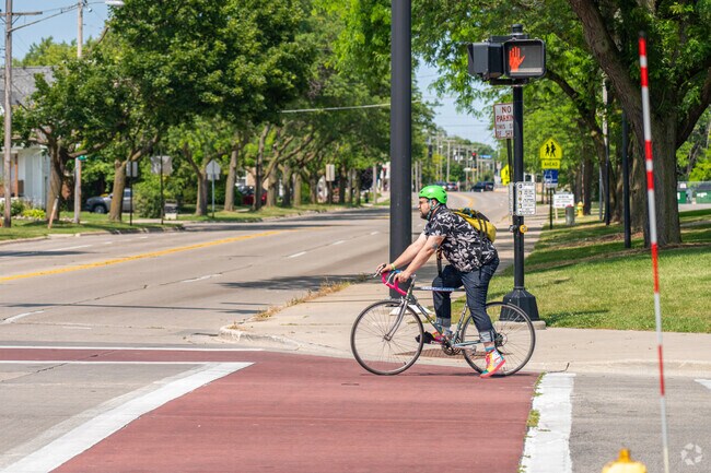 Green Bay resident bikes on S. Baird Street, near Joannes Park in Green Bay, WI.