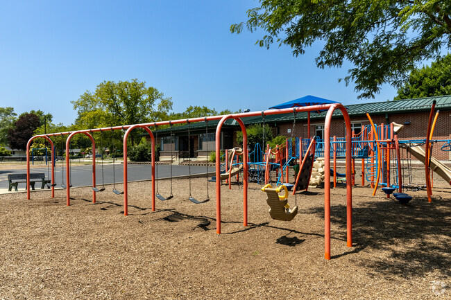 There is a swing set at the Rupley Elementary School grounds.