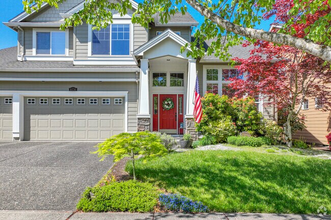 Lush landscaping and archway entrances adorn the homes in Five Oaks.