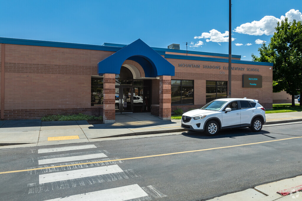 Mountain Shadows Elementary School features blue details at its entrance.