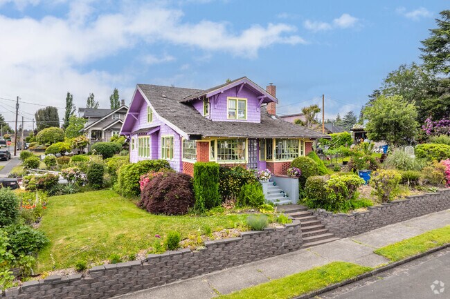 Craftsman bungalows abound in Montesano, with some having lush greenery and vibrant colors.
