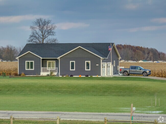 Ranch style home with a tidy lawn in Burnside Township.