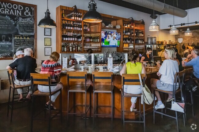Wood & Grain near Rivertowne is a local hotspot for drinks and dinner with amazing seafood and tasty wood-fired pizza.