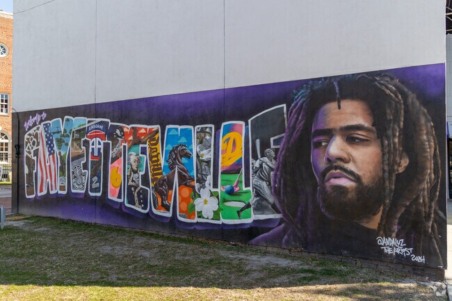 This mural in downtown Fayetteville honors J. Cole who was raised in the city.