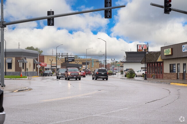 Traffic moves through Central City’s historic downtown, where small-town charm meets everyday convenience.