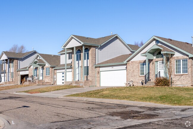 Charming homes line the quiet streets of Indian Hills, blending nature with suburban peace.