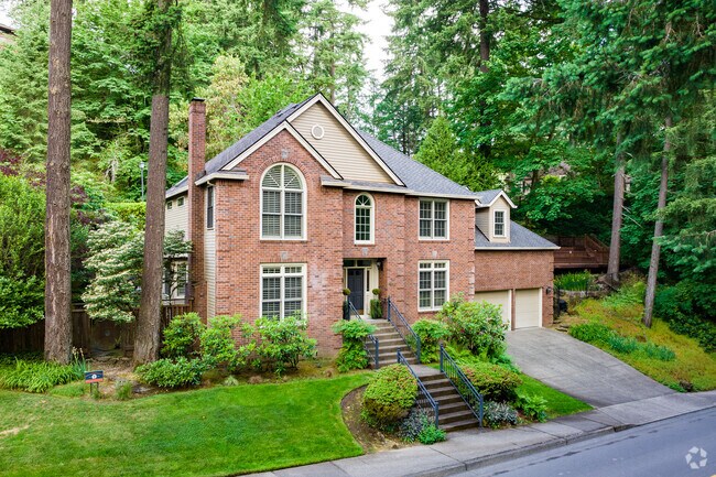 A millennial Manson sits regally amongst towering trees  the Lakeview-Summit Neighborhood.