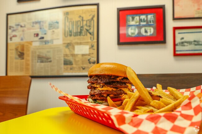 Get The Okie at Hank's in Layman-Van Acres, a cheeseburger with four patties and grilled onions.