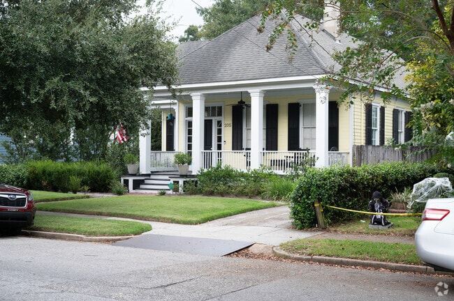 Large white columns accent these Greek Revival homes in Oakdale.