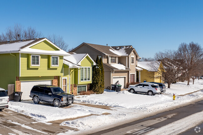 Late 1990s and early 2000s split level homes line the winding streets of Arbor Oaks.