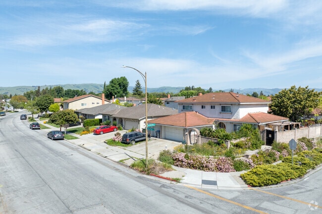 A blend of Ranch and Mediterranean-style homes line quiet, scenic streets in Vinci South near rolling hills.