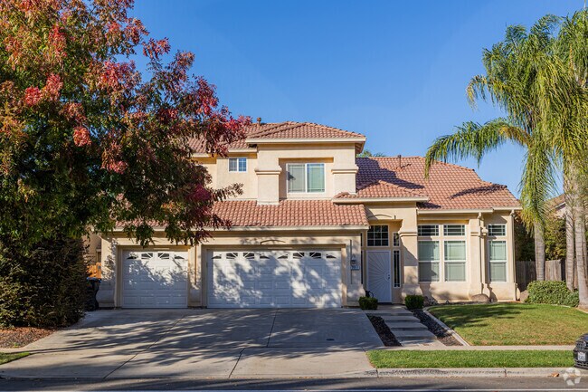 A Mediterranean split level with a clay roof in Village One, Modesto.