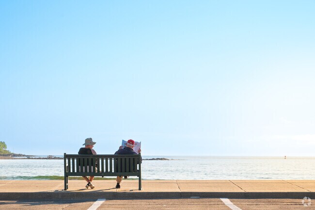 Visitors enjoy the morning sun with beach views in Cape Neddick.