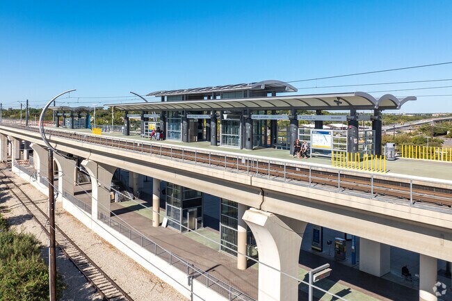 The DART Green Line stops at the Downtown Carrollton Station, offering direct light rail access to Dallas.