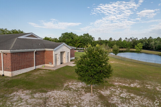 Students see the view of a pond from the open fields at MacClenny Elementary School.