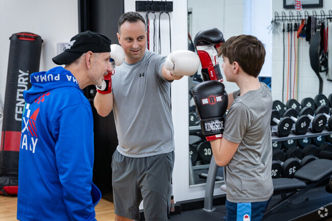 Father and son at a boxing session at Main Event Boxing located in Knightsville, Cranston.