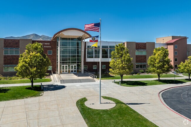 Flags fly in front of Sunset Ridge Middle School.