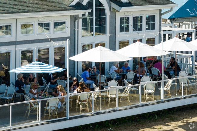 Diners are eating outside on Lindy's waterfront patio.