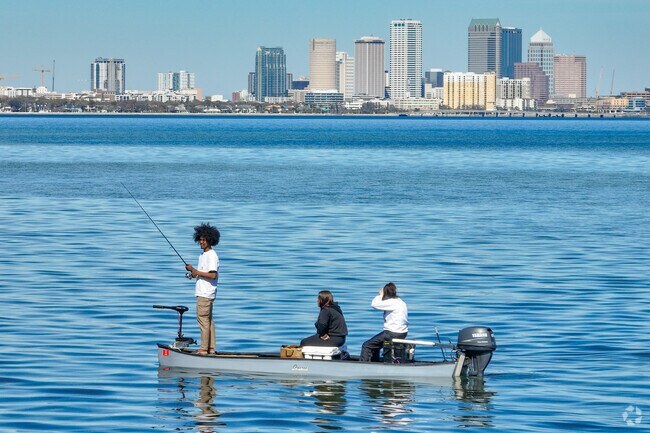 Ballast Point neighbors fish on the waters edge.