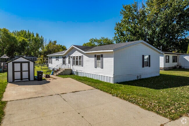 This double-wide manufactured home is a more affordable alternative in Village West.