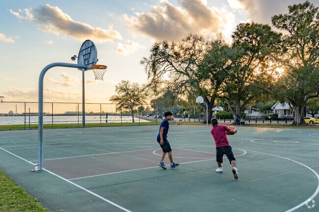 Neighbors of Palmetto Beach love to play basketball on the water.