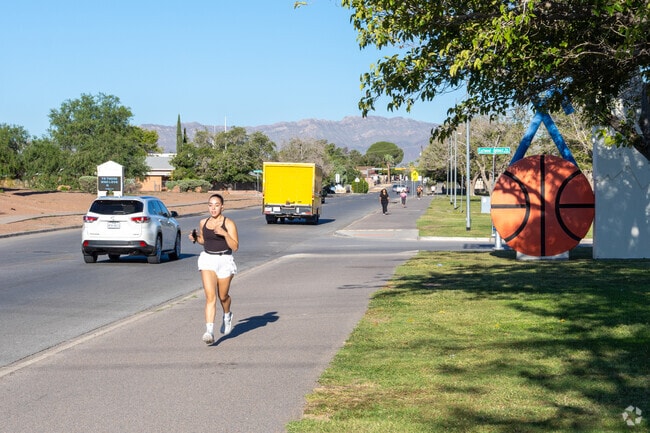 Joggers and walkers alike enjoy the wide walking paths along Eastwood Park, in Pico Norte.