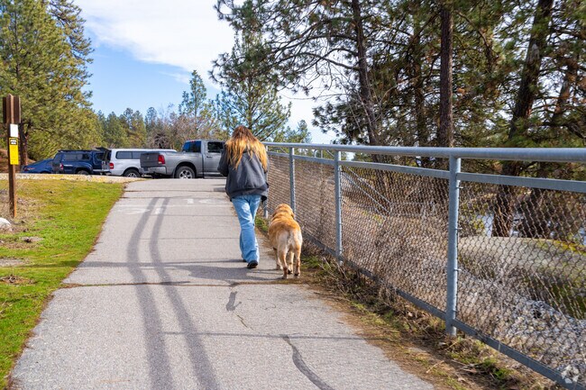 Residents walk their pets along the Centennial Trail in West Valley.